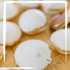 Close-up of luxurious seashell perfume compacts with solid essential oil perfumes, offering a sustainable and eco-friendly fragrance option.