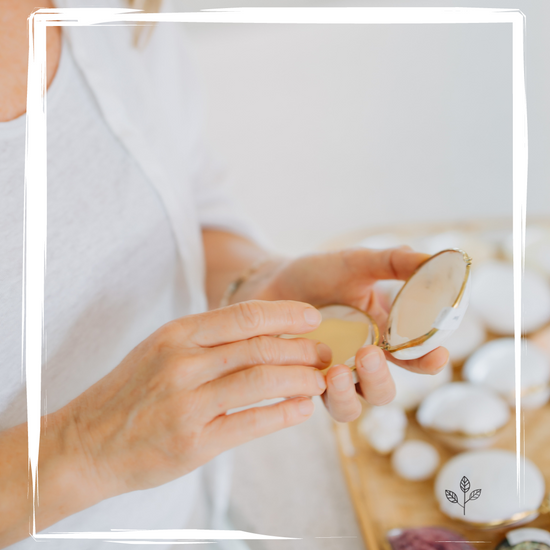 Artisan creating solid perfume compacts, delicately pouring fragrances into real seashells for a one-of-a-kind essential oil perfume experience.