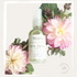 Picture of face serum with essential oils and flowers.